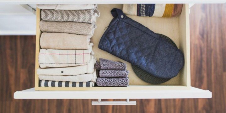 how to fold kitchen towels - folded kitchen towels in cabinet