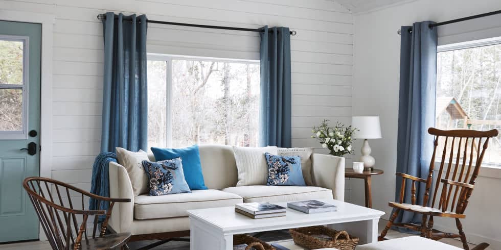 how to make a room look bigger with curtains - living room
