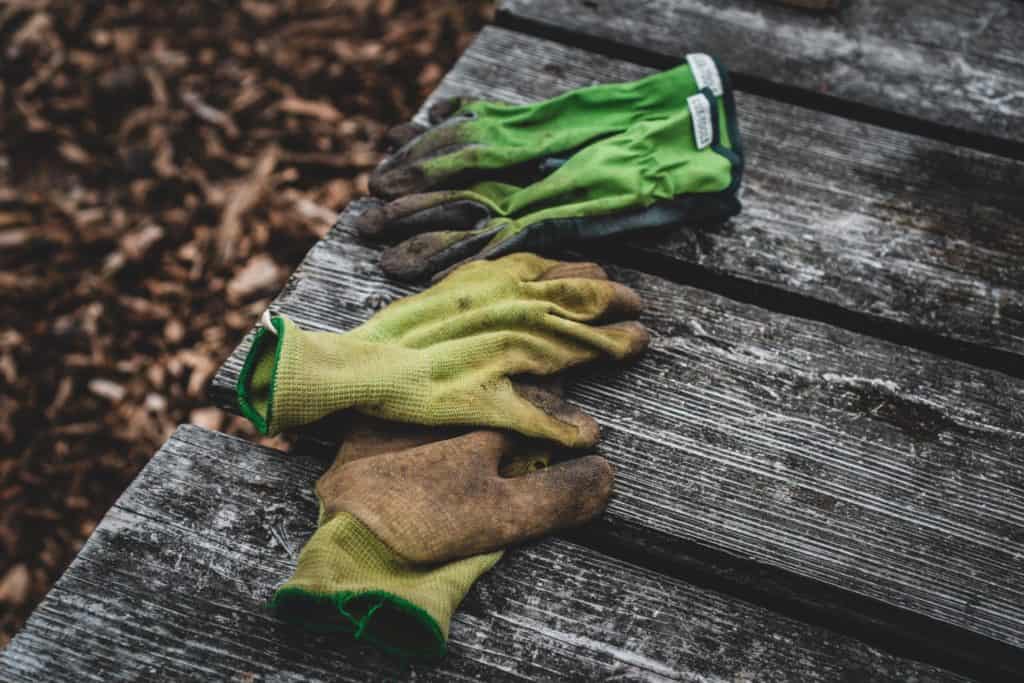 how to wash gardening gloves: different garden gloves on the ground