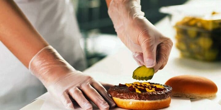 why is jewelry inappropriate to wear in the kitchen - person preparing burger